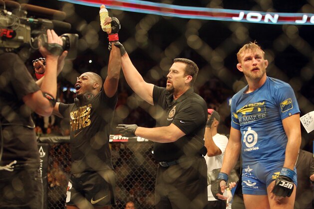 Sep 21, 2013; Toronto, Ontario, CAN; Jon Jones celebrates his victory against Alexander Gustafsson during their light heavyweight championship bout at UFC 165 at the Air Canada Centre. Mandatory Credit: Tom Szczerbowski-USA TODAY Sports