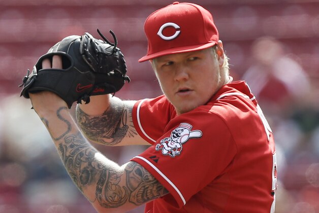 Cincinnati Reds starting pitcher Mat Latos throws against the New York Mets in the first inning of a baseball game, Wednesday, Sept. 25, 2013, in Cincinnati. (AP Photo/Al Behrman)