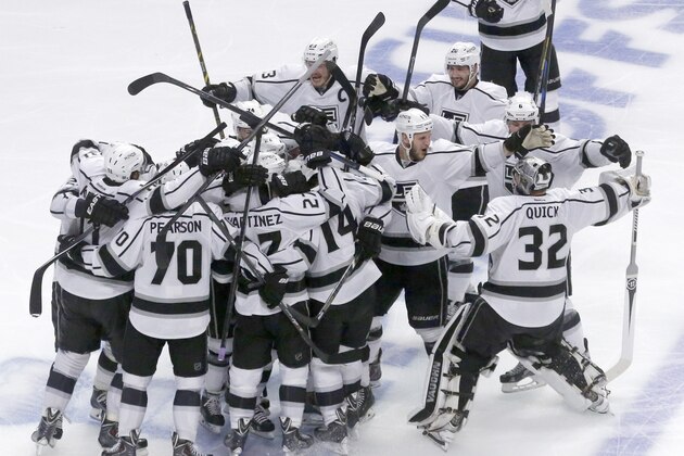 Los Angeles Kings celebrate after defeating Chicago Blackhawks 5-2 in the overtime period in Game 7 of the Western Conference finals in the NHL hockey Stanley Cup playoffs Sunday, June 1, 2014, in Chicago. (AP Photo/Charles Rex Arbogast)