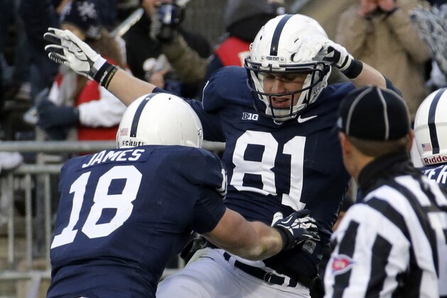 Penn State tight end Adam Breneman (81)  celebrates after taking a pass from Penn State quarterback Christian Hackenberg (14) in the end zone for a touchdown, with teammate Jesse James (18), during an NCAA college football game against Nebraska in State College, Pa., Saturday, Nov. 23, 2013. (AP Photo/Gene J. Puskar)