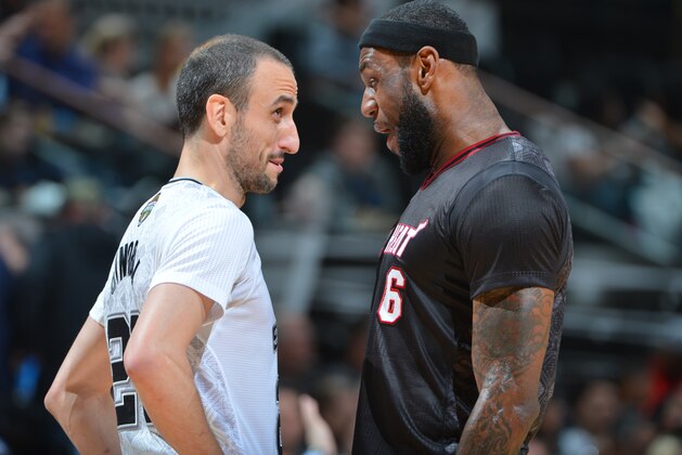 SAN ANTONIO, TX - MARCH 6: Manu Ginobili #20 of the San Antonio Spurs and LeBron James #6 during a game against the Miami Heat at the AT&T Center March 6, 2014 in San Antonio, Texas. NOTE TO USER: User expressly acknowledges and agrees that, by downloading and or using this photograph, User is consenting to the terms and conditions of the Getty Images License Agreement. Mandatory Copyright Notice: Copyright 2014 NBAE (Photo by Jesse D. Garrabrant/NBAE via Getty Images)