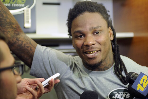 New York Jets NFL football running back Chris Johnson speaks to the media Thursday, May 22, 2014, in Florham Park, N.J. (AP Photo/Bill Kostroun)