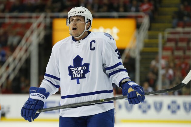 Toronto Maple Leafs defenseman Dion Phaneuf (3) looks to the scoreboard against the Detroit Red Wings in the third period of an NHL hockey game in Detroit, Tuesday, March 18, 2014. Detroit won 3-2. (AP Photo/Paul Sancya)