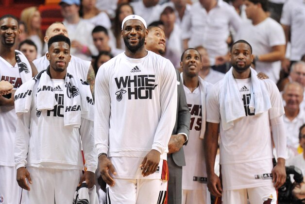 May 30, 2014; Miami, FL, USA; Miami Heat forward LeBron James (middle) leads teammates in celebration from the bench during the second half in game six of the Eastern Conference Finals of the 2014 NBA Playoffs against the Indiana Pacers at American Airlines Arena. Mandatory Credit: Steve Mitchell-USA TODAY Sports