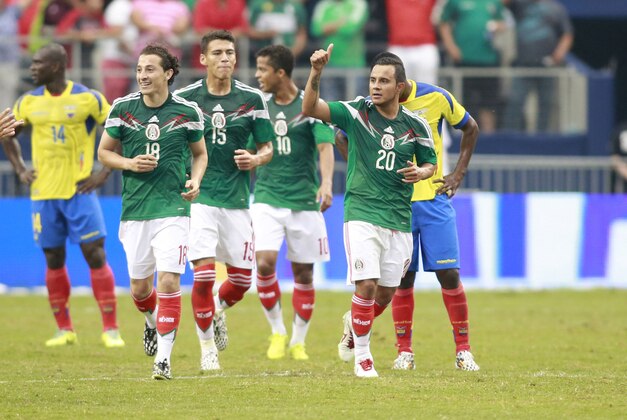 May 31, 2014; Arlington, TX, USA;  Mexico midfielder Luis Montes (20) celebrates scoring a goal in the first half against Ecuador  during a soccer friendly at AT&T Stadium. Mandatory Credit: Tim Heitman-USA TODAY Sports