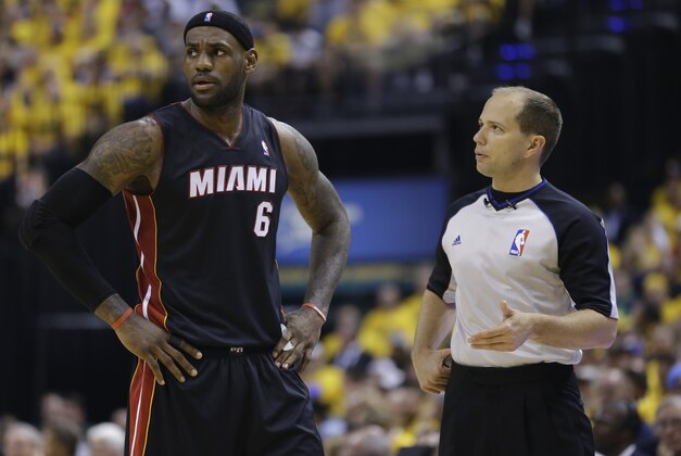 Miami Heat forward LeBron James, left, talks with referee John Goble during the fourth quarter of Game 2 of the NBA basketball Eastern Conference finals against the Indiana Pacers in Indianapolis, Tuesday, May 20, 2014. The Heat defeated the Pacers 87-83 to tie the series at 1-1. (AP Photo/Michael Conroy)