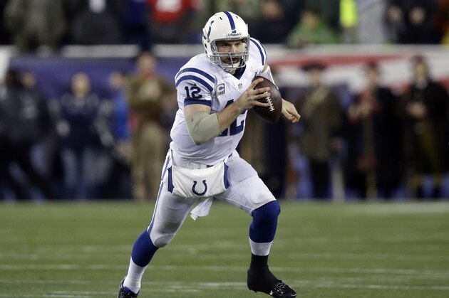 Indianapolis Colts quarterback Andrew Luck runs with the ball during the first half of an AFC divisional NFL playoff football game against the New England Patriots in Foxborough, Mass., Saturday, Jan. 11, 2014. (AP Photo/Stephan Savoia)