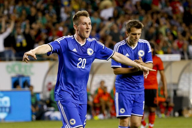 Bosnia-Herzegovina forward Izet Hajrovic celebrates after scoring against Mexico during the first half of an international friendly soccer match at Soldier Field in Chicago, Tuesday, June 3, 2014. (AP Photo/Kamil Krzaczynski) Bosnia-Herzegovina forward Izet Hajrovic celebrates after scoring against Mexico during the first half of an international friendly soccer match at Soldier Field in Chicago, Tuesday, June 3, 2014. (AP Photo/Kamil Krzaczynski)