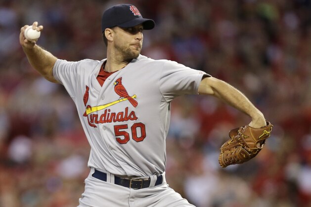 St. Louis Cardinals starting pitcher Adam Wainwright throws against the Cincinnati Reds in the third inning of a baseball game, Sunday, May 25, 2014, in Cincinnati. (AP Photo/Al Behrman)