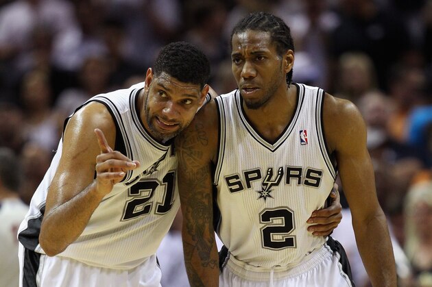 SAN ANTONIO, TX - MAY 29: Tim Duncan #21 and Kawhi Leonard #2 of the San Antonio Spurs talk in the second quarter against the Oklahoma City Thunder during Game Five of the Western Conference Finals of the 2014 NBA Playoffs at AT&T Center on May 29, 2014 in San Antonio, Texas. NOTE TO USER: User expressly acknowledges and agrees that, by downloading and or using this photograph, User is consenting to the terms and conditions of the Getty Images License Agreement.  (Photo by Ronald Martinez/Getty Images)