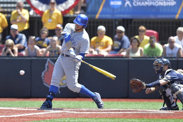 Kentucky's A.J. Reed swings to hit a double to score Kentucky's first of four runs in the ninth during an NCAA college baseball regional tournament game in Louisville, Ky., Saturday, May 31, 2014. Kentucky defeated Kent State 4-2. (AP Photo/Timothy D. Easley)