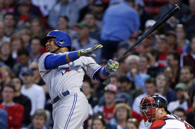 Toronto Blue Jays' Edwin Encarnacion hits his second home run of the game, in front of Boston Red Sox catcher A.J. Pierzynski in the third inning of a baseball game at Fenway Park in Boston, Wednesday, May 21, 2014. (AP Photo/Elise Amendola)