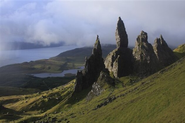 View of upland landscape with rock pinnacles, Old Man of Storr, Storr, Trotternish Peninsula, Isle of Skye, Inner Hebrides, Scotland, august (Photo by: Minden Pictures/AP Images)