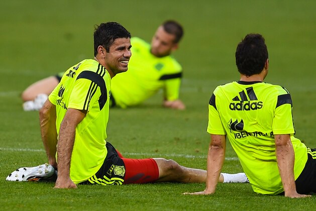 WASHINGTON, DC - JUNE 03:  Diego Costa (L) of Spain shares a joke with his teammate Santi Cazorla after a training session of the Spain National Team at the Robert F. Kennedy Stadium on June 3, 2014 in Washington, DC.  (Photo by David Ramos/Getty Images)
