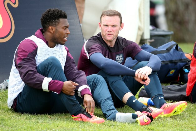 VALE DO LOBO, ALGARVE, PORTUGAL - MAY 21:  Daniel Sturridge and Wayne Rooney relax during a training session at the England pre-World Cup Training Camp at the Vale Do Lobo Resort on May 21, 2014 in Vale Do Lobo, Algarve, Portugal.  (Photo by Richard Heathcote/Getty Images)