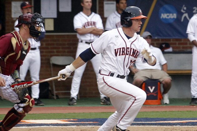 Virginia's Derek Fisher (23) hits the ball during the NCAA regional college game against Elon in Charlottesville, Va., Sunday June 2, 2013. Virginia defeated Elon 11-3. (AP Photo/Andrew Shurtleff)