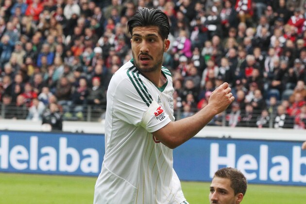 Leverkusen's Emre Can reacts after scoring his side's second goal against Frankfurt goalkeeper Kevin Trapp during the German Bundesliga soccer match between Eintracht Frankfurt and Bayer 04 Leverkusen in Frankfurt, Germany, Saturday, May 3, 2014. (AP Photo/Michael Probst)
