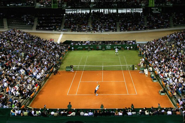 MALLORCA, SPAIN - MAY 2:  Rafael Nadal of Spain in action against Roger Federer of Switzerland during 'The Battle of the Surfaces' at The Palma Arena on May 2, 2007 in Mallorca, Spain. (Photo by Clive Brunskill/Getty Images)