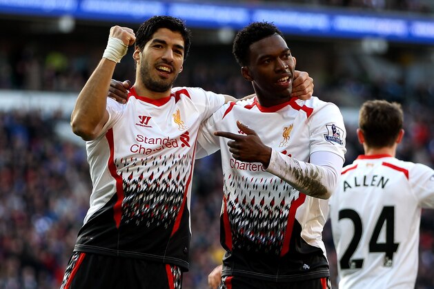 CARDIFF, WALES - MARCH 22:  Daniel Sturridge of Liverpool celebrates with team mate Luis Suarez after scoring his team's fifth goal during the Barclays Premier League match between Cardiff City and Liverpool at Cardiff City Stadium on March 22, 2014 in Cardiff, Wales.  (Photo by Ben Hoskins/Getty Images)