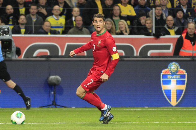 Portugal's Cristiano Ronaldo goes with the ball during the World Cup qualifying playoff second leg soccer match between Sweden and Portugal in Stockholm, Sweden, Tuesday, Nov.19, 2013. (AP Photo/Frank Augstein)