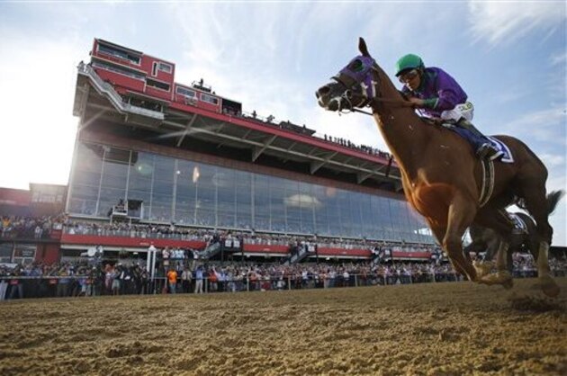 California Chrome, ridden by jockey Victor Espinoza, wins the 139th Preakness Stakes horse race at Pimlico Race Course, Saturday, May 17, 2014, in Baltimore.  (AP Photo/Matt Slocum)