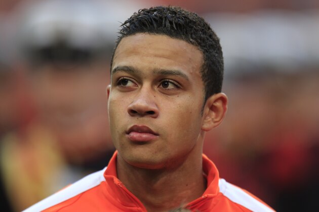 Netherlands' Memphis Depay lines up prior to the international friendly soccer match between Netherlands and Ecuador at ArenA stadium in Amsterdam, Netherlands, Saturday, May 17, 2014. (AP Photo/Peter Dejong)