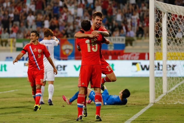 DUBAI, UNITED ARAB EMIRATES - NOVEMBER 19: Roman Shirokov and Fedor Smolov of Russia celebrate a goal during the International Football match between South Korea and Russia at the Zabeel Staduim on November 19, 2013 in Dubai, United Arab Emirates.  (Photo by Francois Nel/Getty Images)