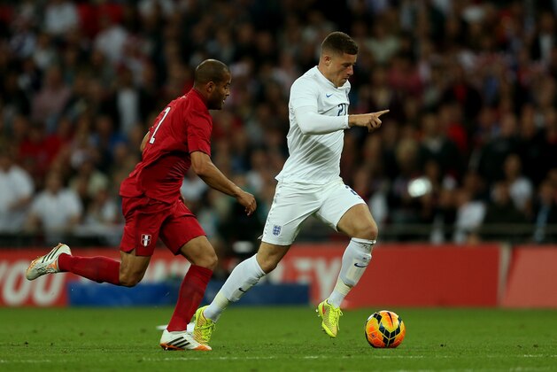 LONDON, ENGLAND - MAY 30: Alberto Rodriguez of Peru closes down Ross Barkley of England during the international friendly match between England and Peru at Wembley Stadium on May 30, 2014 in London, England.  (Photo by Warren Little/Getty Images)