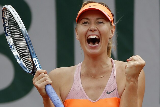Russia's Maria Sharapova reacts as she defeats Spain's Garbine Muguruza during their quarterfinal match of  the French Open tennis tournament at the Roland Garros stadium, in Paris, France, Tuesday, June 3, 2014. Sharapova won 1-6, 7-5, 6-1. (AP Photo/Michel Euler)