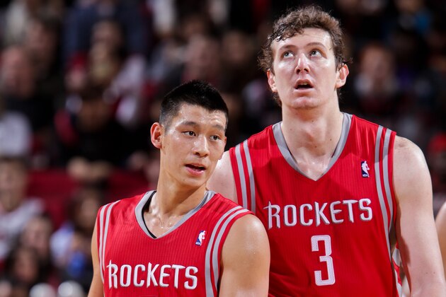 PORTLAND, OR - NOVEMBER 16: Jeremy Lin #7 and Omer Asik #3 of the Houston Rockets wait to resume action against the Portland Trail Blazers on November 16, 2012 at the Rose Garden Arena in Portland, Oregon. NOTE TO USER: User expressly acknowledges and agrees that, by downloading and or using this photograph, user is consenting to the terms and conditions of the Getty Images License Agreement. Mandatory Copyright Notice: Copyright 2012 NBAE (Photo by Sam Forencich/NBAE via Getty Images)