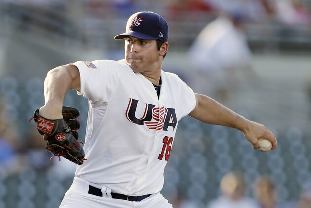 United States pitcher Carlos Rodon throws during the first inning of an exhibition game against Cuba, Thursday, July 18, 2013, in Des Moines, Iowa. (AP Photo/Charlie Neibergall)
