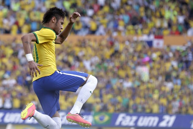 Brazil's Neymar celebrates after scoring against Panama during a friendly soccer match at the Serra Dourada stadium in Goiania, Brazil, Tuesday, June 3, 2014. (AP Photo/Andre Penner)