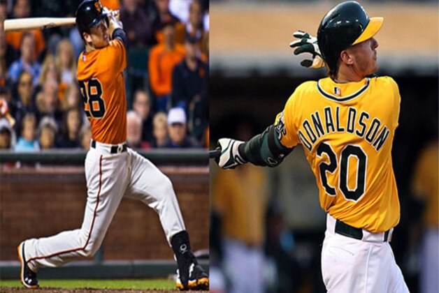 San Francisco Giants center fielder Andres Torres, right, steals second base as Oakland Athletics shortstop Cliff Pennington, left, waits for the throw as Athletics' second baseman Mark Ellis, rear, looks on during the first inning of their baseball game in San Francisco, Friday, May 20, 2011. A's catcher Kurt Suzuki was given an error on the play and Torres advanced to third. (AP Photo/Eric Risberg)