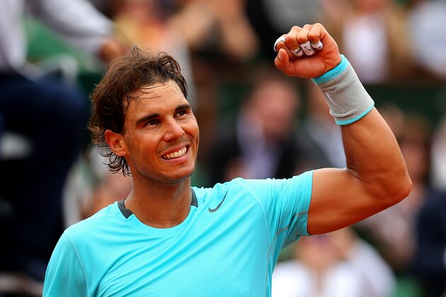 PARIS, FRANCE - JUNE 02:  Rafael Nadal of Spain celebrates victory in his men's singles match against Dusan Lajovic of Serbia on day nine of the French Open at Roland Garros on June 2, 2014 in Paris, France.  (Photo by Clive Brunskill/Getty Images)