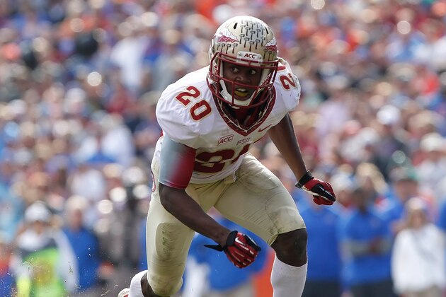 Nov 30, 2013; Gainesville, FL, USA; Florida State Seminoles defensive back Lamarcus Joyner (20) rushes against the Florida Gators during the second half at Ben Hill Griffin Stadium. Florida State Seminoles defeated the Florida Gators 37-7. Mandatory Credit: Kim Klement-USA TODAY Sports