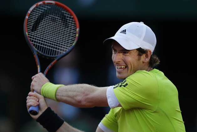 Britain's Andy Murray returns the ball during the quarterfinal match of the French Open tennis tournament against France's Gael Monfils at the Roland Garros stadium, in Paris, France, Wednesday, June 4, 2014. (AP Photo/David Vincent)