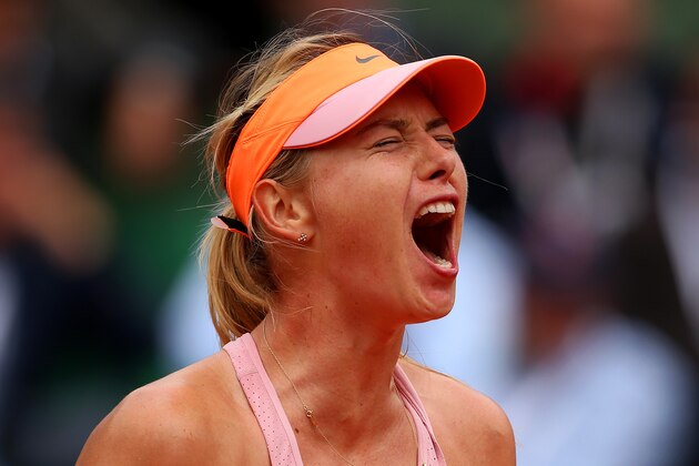 PARIS, FRANCE - JUNE 03:  Maria Sharapova of Russia celebrates a point during her women's singles match against Garbine Muguruza of Spain on day ten of the French Open at Roland Garros on June 3, 2014 in Paris, France.  (Photo by Clive Brunskill/Getty Images)
