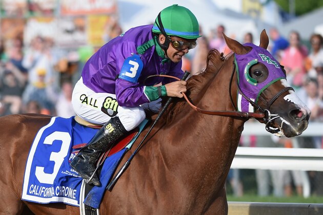 BALTIMORE, MD - MAY 17:  California Chrome #3, ridden by Victor Espinoza, races to the finishline to win the 139th running of the Preakness Stakes at Pimlico Race Course on May 17, 2014 in Baltimore, Maryland.  (Photo by Molly Riley/Getty Images)