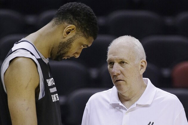 San Antonio Spurs forward Tim Duncan, left and head coach Gregg Popovich talk during basketball practice on Wednesday, June 4, 2014 in San Antonio. The Spurs play Game 1 of the NBA Finals against the Miami Heat on Thursday. (AP Photo/Tony Gutierrez)