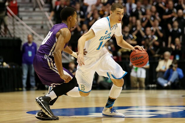 SAN DIEGO, CA - MARCH 23:  Zach LaVine #14 of the UCLA Bruins drives against Trey Pinkney #10 of the Stephen F. Austin Lumberjacks in the second half during the third round of the 2014 NCAA Men's Basketball Tournament at Viejas Arena on March 23, 2014 in San Diego, California.  (Photo by Jeff Gross/Getty Images)