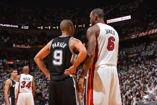 MIAMI, FL - JUNE 18: Tony Parker #9 of the San Antonio Spurs talks to LeBron James #6 of the Miami Heat during Game Six of the 2013 NBA Finals on June 18, 2013 at American Airlines Arena in Miami, Florida. NOTE TO USER: User expressly acknowledges and agrees that, by downloading and or using this photograph, User is consenting to the terms and conditions of the Getty Images License Agreement. Mandatory Copyright Notice: Copyright 2013 NBAE (Photo by Jesse D. Garrabrant/NBAE via Getty Images)