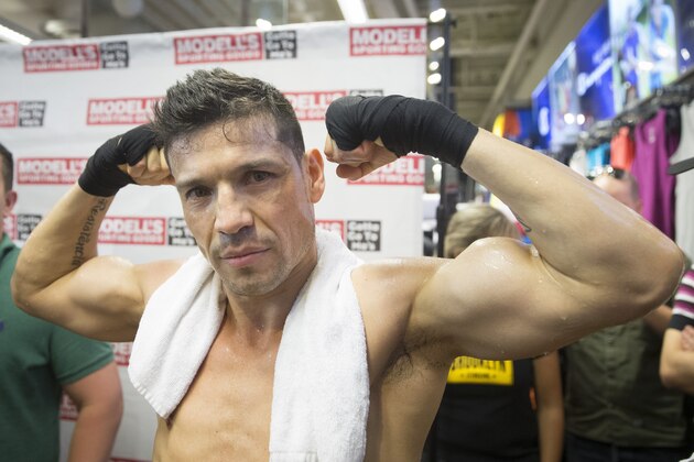 WBC middleweight champion Sergio Martinez poses for a photo following a media workout at Modell's in Times Square Monday, June 2, 2014, in New York. Martinez squares off against challenger Miguel Cotto at Madison Square Garden on Saturday, June 7. (AP Photo/John Minchillo)