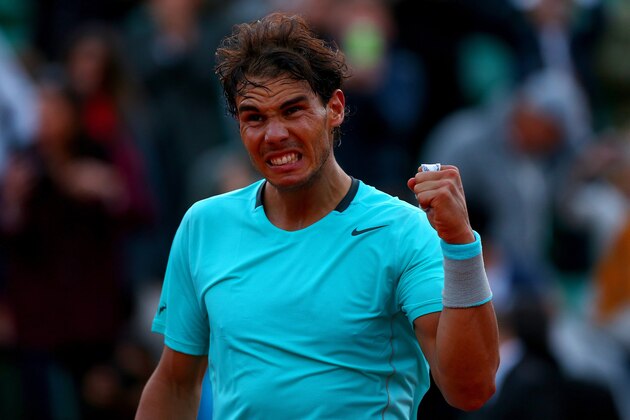 PARIS, FRANCE - JUNE 04:  Rafael Nadal of Spain celebrates victory in his men's singles quarter-final match against David Ferrer of Spain on day eleven of the French Open at Roland Garros on June 4, 2014 in Paris, France.  (Photo by Dan Istitene/Getty Images)