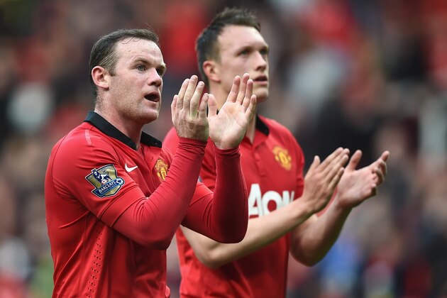 MANCHESTER, ENGLAND - APRIL 26: Wayne Rooney and Phil Jones of Manchester United applaud the fans after the Barclays Premier League match between Manchester United and Norwich City at Old Trafford on April 26, 2014 in Manchester, England. (Photo by Laurence Griffiths/Getty Images) MANCHESTER, ENGLAND - APRIL 26: Wayne Rooney and Phil Jones of Manchester United applaud the fans after the Barclays Premier League match between Manchester United and Norwich City at Old Trafford on April 26, 2014 in Manchester, England. (Photo by Laurence Griffiths/Getty Images)
