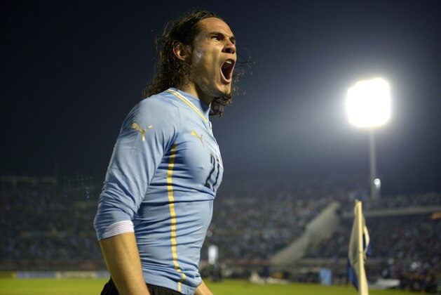 Uruguay's Edinson Cavani celebrates after scoring against  Slovenia during a friendly soccer match in Montevideo, Uruguay, Wednesday, June 4, 2014. (AP Photo/Matilde Campodonico)
