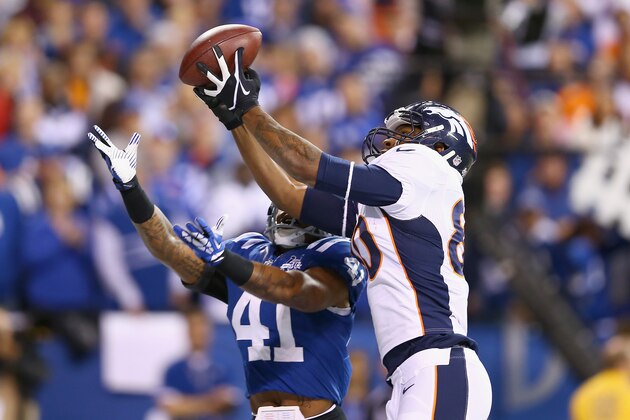 INDIANAPOLIS, IN - OCTOBER 20:  Julius Thomas #80 of the Denver Broncos catches a touchdown pass in front of Antoine Bethea #41 of the Indianapolis Colts at Lucas Oil Stadium on October 20, 2013 in Indianapolis, Indiana.  (Photo by Andy Lyons/Getty Images)