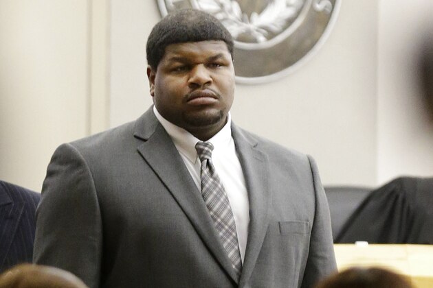 Former Dallas Cowboys Josh Brent stands as potential jurors are directed into the courtroom Friday, Jan. 10, 2014, in Dallas.  Jury selection continues for the upcoming trial of Brent, who's accused of killing a practice squad player in a drunken-driving wreck.   Opening statements in the case are expected next week. (AP Photo/LM Otero)