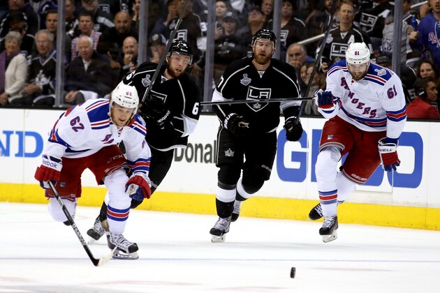 LOS ANGELES, CA - JUNE 04:  Carl Hagelin #62 and Rick Nash #61 of the New York Rangers go after the puck in the third period while taking on the Los Angeles Kings during Game One of the 2014 NHL Stanley Cup Final at the Staples Center on June 4, 2014 in Los Angeles, California.  (Photo by Bruce Bennett/Getty Images)