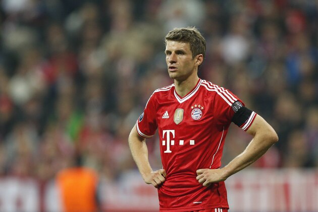 Bayern's Thomas Mueller watches his team mates during the Champions League semifinal second leg soccer match between Bayern Munich and Real Madrid at the Allianz Arena in Munich, southern Germany, Tuesday, April 29, 2014. (AP Photo/Matthias Schrader)