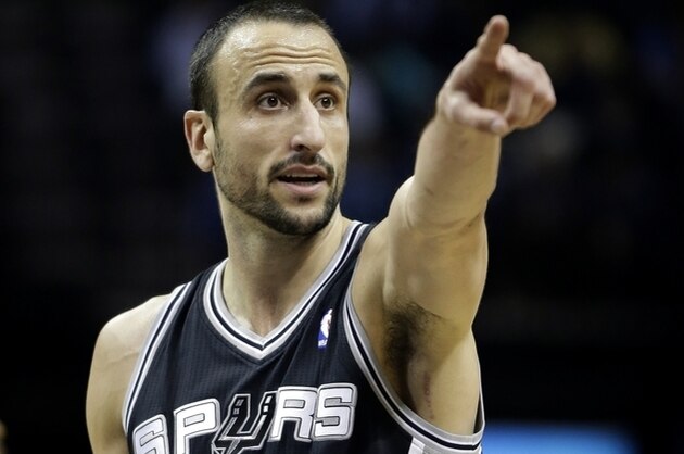 San Antonio Spurs guard Manu Ginobili, of Argentina, points in the second half of an NBA basketball game against the Memphis Grizzlies in Memphis, Tenn., Tuesday, Jan. 7, 2014. The Spurs defeated the Grizzlies 110-108 in overtime. (AP Photo/Danny Johnston)